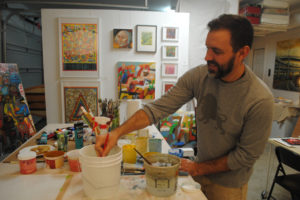 Paul Solevad rinses his brush in his studio on Nov. 3. This was Solevad's fourth year participating in Clark County Open Studios.