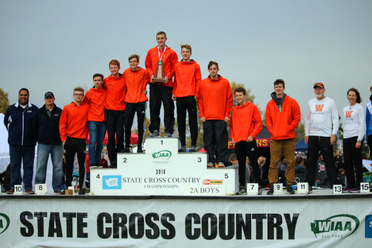 The best boys cross country team in Washougal High history celebrates a second place team finish with pictures at the state cross country championships in Pasco on Nov.