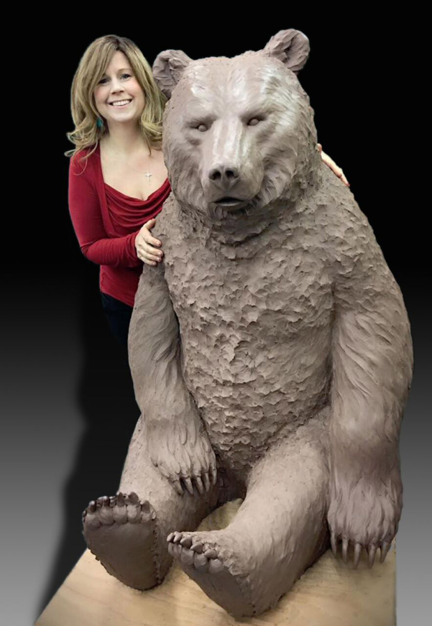 Heather Soderberg-Green, of Cascade Locks, Ore., stands by a bear sculpture that will eventually be sited in Washougal. The Washougal Arts and Culture Alliance is seeking $15,000 in donations to complete the purchase of the $30,000 bear. (Contributed photo courtesy of Rene Carroll)