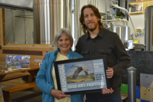 The Washougal Arts and Culture Alliance (WACA) honors former Washougal City Councilwoman Joyce Lindsay and street artist Travis London during a 'Celebration of the Arts' reception, Nov. 3, at 54?40' Brewing Co., in Washougal. London was recognized for the art he has added to several buildings in Washougal and Camas, and Lindsay, a WACA board member, was thanked for bringing high quality public art to Washougal. (Contributed photos courtesy of Rene Carroll)