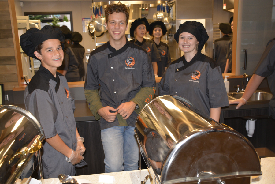 Washougal High School culinary students (left to right) Zachariah Schroeder, Michael Gonser and Paige Limbo help prepare a dinner for the recent Business Connections dinner. (Contributed photos courtesy of Rene Carroll, Washougal School District)