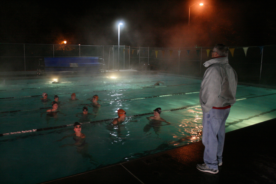 Photo: Wayne Havrelly Post-Record 
 It's colder for the coach than the swimmers as Mike Bemis instructs state bound swimmers from Camas and Washougal at the outdoor pool at Cascade Athletic Club in Vancouver.