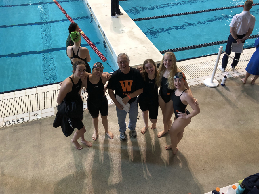 Head coach Mike Bemis congratulates Washougal swimmers at the state championships in Federal Way on Saturday, Nov. 10.  (left to right) Charlotte Baker, Kaylyn Schmid, Mike Bemis, Lily Seitz, Merritt Jones, Kyra Schmid (Photo courtesy, Debbie Schmid)