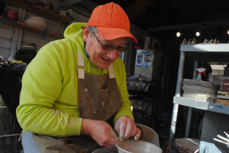 Ted Norris, 60, works at the pottery wheel in his garage studio on Nov. 15. Norris is starting a studio on Northwest Sixth Avenue in December.