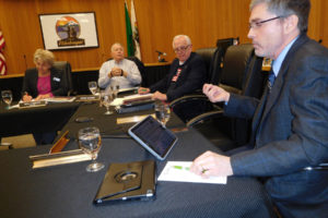 Washougal City Administrator David Scott (right) explains during a Nov. 13, council workshop the process that will occur when the city's form of government changes from mayor-council, or "strong mayor," to council-manager or "strong council." The majority of Washougal's general election voters approved the change, which will go into effect on Nov. 27. 