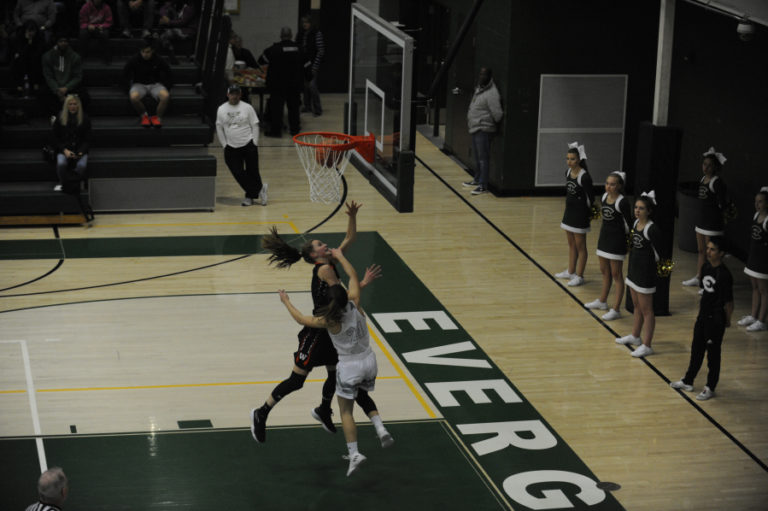 Jaden Bea challenges a defender at the hoop. She had 10 points, four rebounds and five steals in her first ever high school game against Evergreen High School, on Monday, Nov.