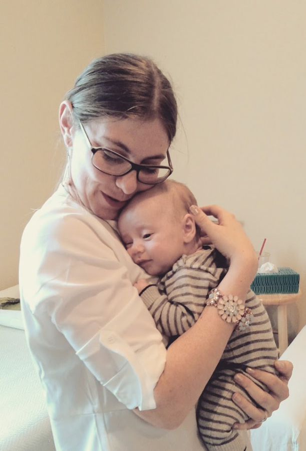Bryna Sampey holds one of her client&#039;s babies. Sampey, a doula specializing in high-risk and cesarean births, and a Internationally Board Certified Lactation Consultant, is the owner of the Camas-based business, Doula My Soul LLC.