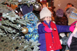A child enjoys the "snow" at a 2015 Hometown Holidays celebration in downtown Camas. This year's holiday festival will be held throughout the city's downtown from 5 to 9 p.m., Friday, Dec. 7, with a tree lighting and fireworks at 6:30 p.m. (Post-Record file photo)