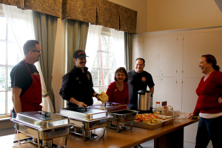 Camas Mayor Shannon Turk (right) laughs with volunteers at the second annual Christmas Eve community breakfast at the Camas Community Center on Dec. 24. Pictured from left to right in the breakfast-serving line are firefighter-paramedic Capt. Greg Weisser, firefighter-paramedic Trevor Guay, Vicki Kerr of Partners with Camas Parks and Recreation and East Clark Professional Fire Fighters President Adam Brice.