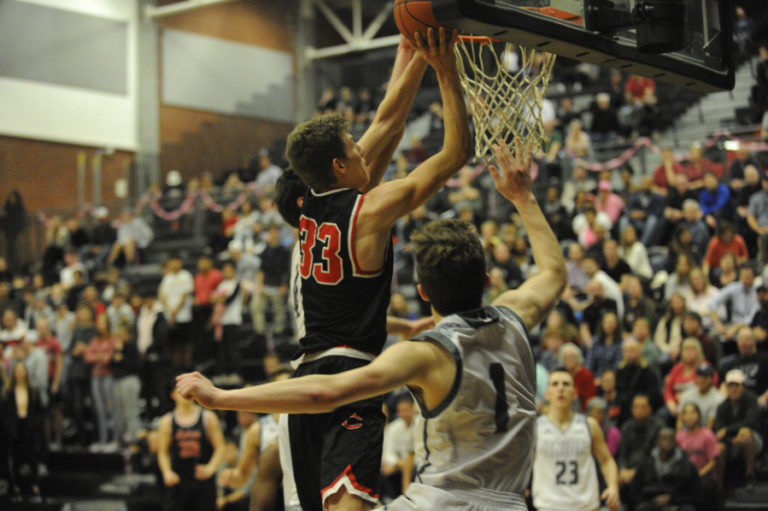 Camas High junior Jackson Clemmer rises to the rim against rivals from Union High on Dec. 17. Clemmer broke out offensively during the Union game, scoring 10 points in a tough battle.