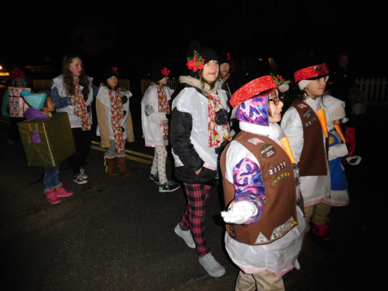 (Dawn Feldhaus/Post-Record)  Local Girl Scouts march along Main Street in the annual Lighted Christmas Parade, presented by the City of Washougal and the Downtown Washougal Association, Dec. 6.
