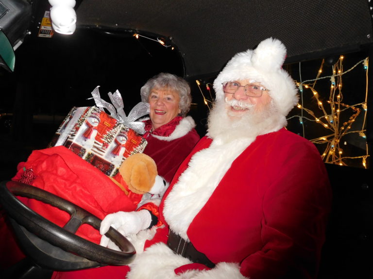 (Dawn Feldhaus/Post-Record) Santa and Mrs. Claus delight the crowd in the annual Lighted Christmas Parade, presented by the City of Washougal and the Downtown Washougal Association, Dec. 6.
