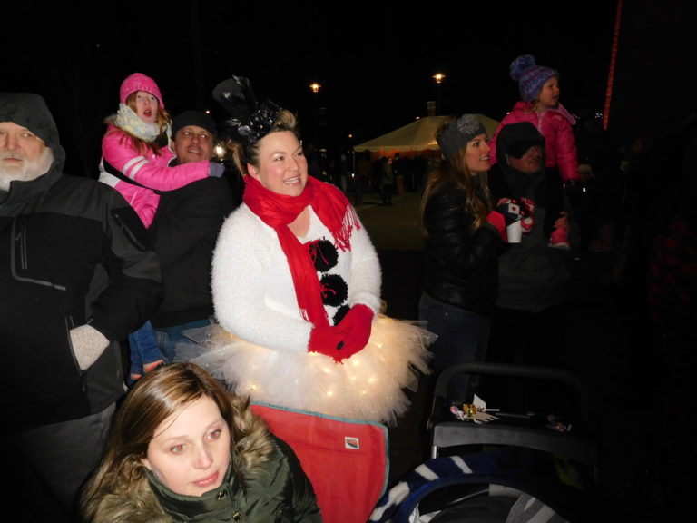 (Dawn Feldhaus/Post-Record)  Washougal Christmas Parade watchers bundle up to watch the procession along Main Street, Thursday, Dec. 6.
