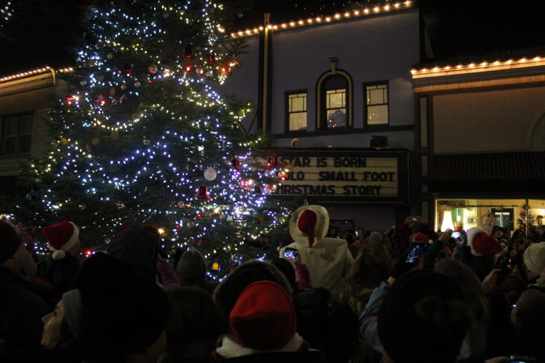 Crowds turn their heads toward the sky in downtown Camas Friday night to see the fireworks show, which follows the Christmas tree lighting at the annual Hometown Holidays celebration.