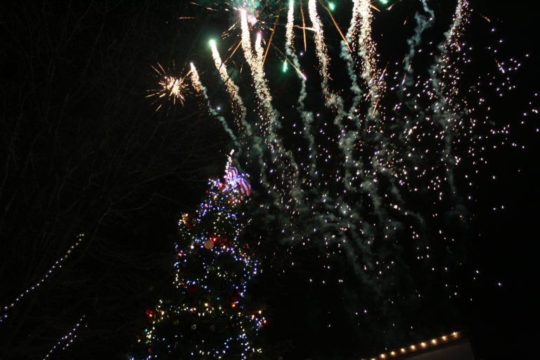 Fireworks light the sky above the just-lit Christmas tree in downtown Camas at the 2018 Hometown Holidays event, Friday, Dec. 7. 