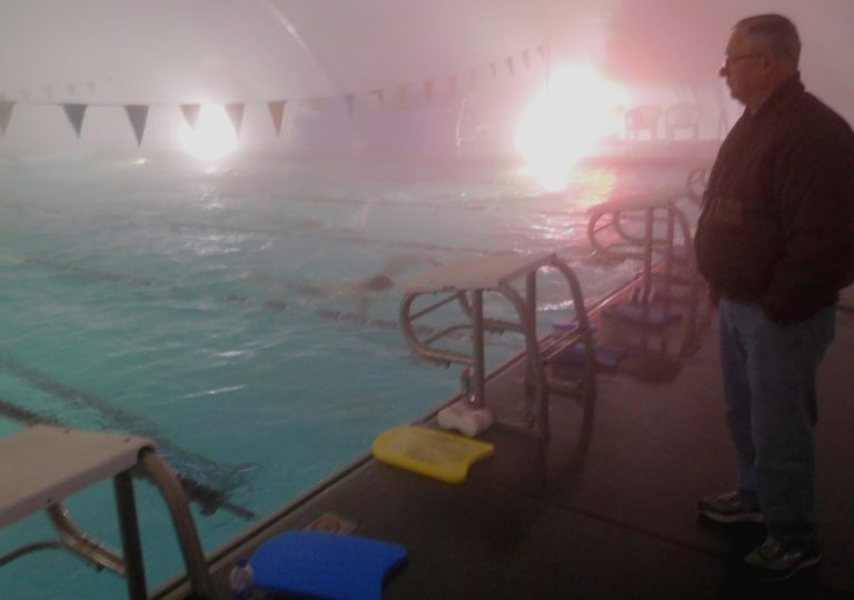 Coach Mike Bemis watches swimmers train at Cascade Athletic Club in Vancouver.