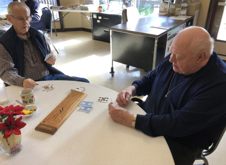 Don Edney (left) and Wally Budsberg (right) play cribbage at the Washougal Senior Center on Monday, Jan. 7. Budsberg, a retired engineer, moved to Washougal in early 2018 and quickly found new friends at the local senior center.