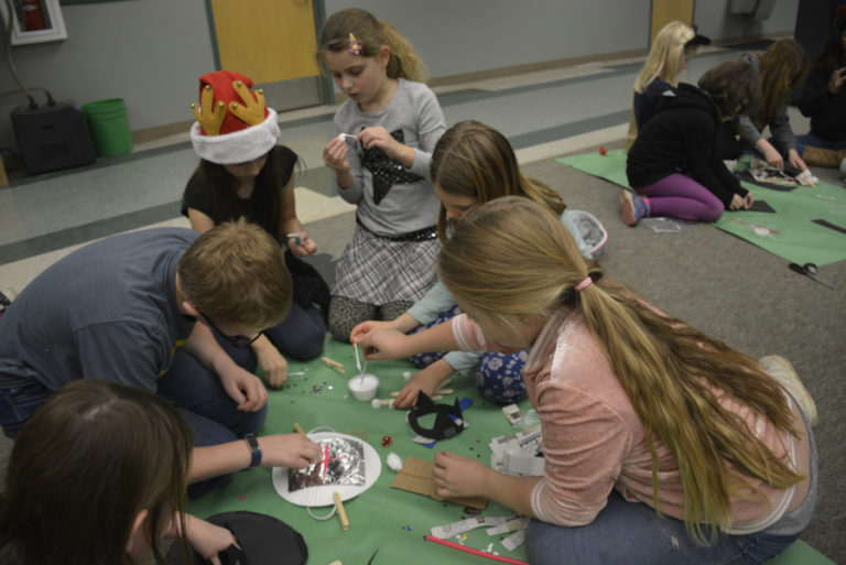 Clockwise from second from left: Washougal students Wyatt Taylor, Alyssa Jackson, Amelia Volosenco and Claire Taylor compete in a &quot;Battle of the Books&quot; tournament at Cape Horn-Skye Elementary School on Dec.