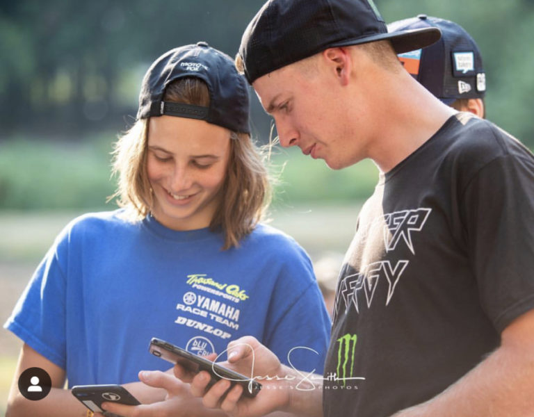 Levi Kitchen, 17, of Washougal (left) exchanges Snapchat user names with 250 pro motocross rider Adam Cianciarulo (right).