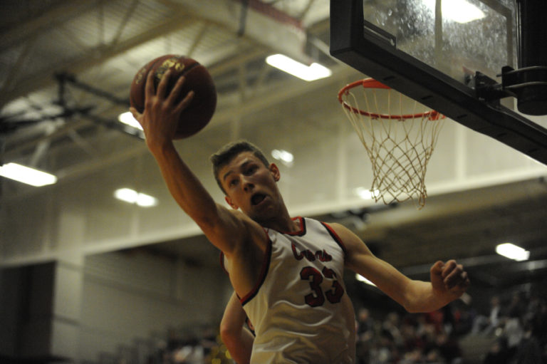 Camas High junior Jackson Clemmer, a 6&#039;7&quot; forward, goes after a rebound against Union at a Jan. 18 game.