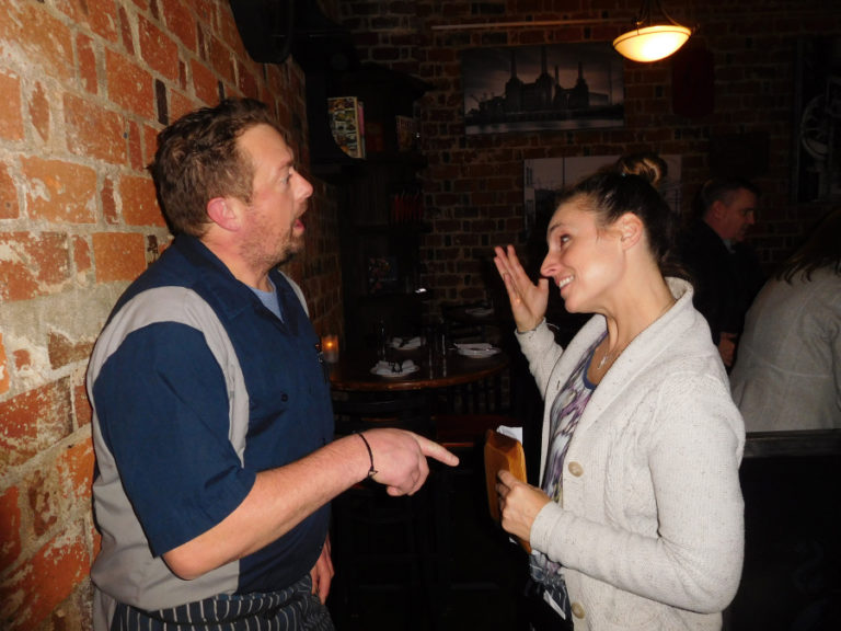 Tim and Melissa McCusker enjoy a lighthearted moment during a busy dinner shift, Friday, Jan. 11, at their steak and seafood restaurant, Feast 316. Tim said he and Melissa are very good friends, which helps them work together and get along.