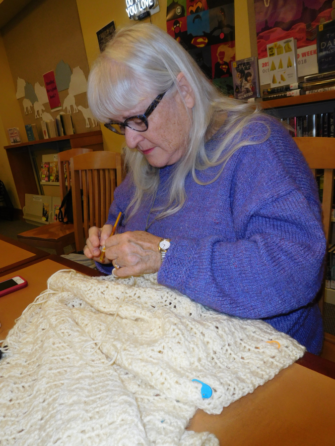 Cheryl Lawson, of Camas, makes a prayer shawl Jan. 17, during Crochet Club at the Camas Public Library.