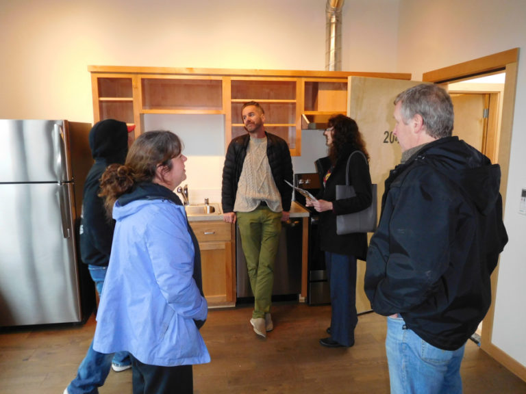 Kevin Cavenaugh, owner of the Portland-based Guerrilla Development Co. (center), greets guests during an open house on Sunday, Jan. 20, at the Rig-A-Hut building, a retail and residential mixed-use development in downtown Washougal. Another open house will be held from 10 a.m. to 2 p.m., Sunday, Jan.