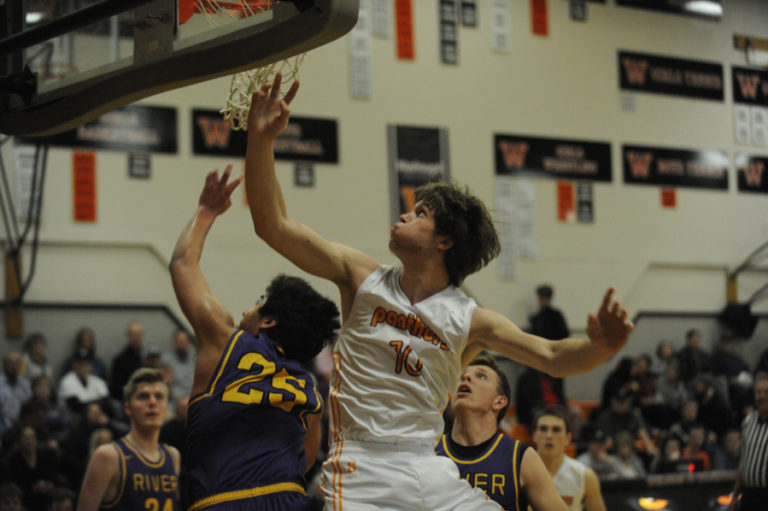 Washougal junior Dalton Payne attempts a layup against the undefeated Chieftains from Columbia River High School.