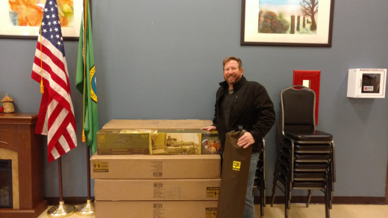 Washougal pastor Robert Barber shows some of the supplies that a $3,500 emergency grant from the Camas-Washougal Community Chest purchased for the Washougal-Camas severe weather shelter, located in the Washougal Community Center.