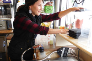 Marcie Wilcox, co-owner of Squeeze and Grind, makes a fruit smoothie at the Camas coffee shop on Feb. 8. She will continue to work at Squeeze and Grind, a 20-year-old coffee shop, smoothie and juice bar, after she and her husband, Jeramy Wilcox, open Cedar Street Bagel Company in April. 