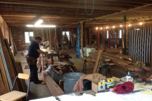 Mark Nichols, a Portland-based remodeler, works on framing the second floor walls of the Blair Building in downtown Washougal, in October 2016. The upper level of the historic building on Main Street has been transformed into four studio apartments with modern amenities. (Contributed photo courtesy of Heidi Kramer)