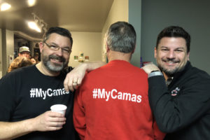 From left to right: Craig Schulstad, Randy Curtis and Adrian Bucur show their "MyCamas" pride Feb. 12, at Caffe Piccolo in downtown Camas, while waiting to hear if Camas had made the top towns vying for Season 4 of "Small Business Revolution -- Main Street." (Contributed photo courtesy of Downtown Camas Association)