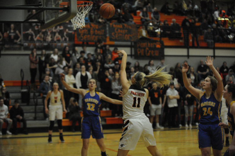 Washougal senior Mckinley Stotts puts up a soft shot in the final minutes of the Panthers first playoff game against Rochester at home on Wednesday, Feb.