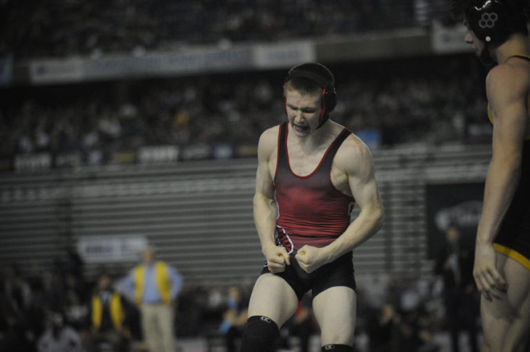Tanner Craig celebrates after a close victory at the Tacoma Dome that sent him to the finals where he won his second state title.  Next season Craig will wrestle for West Point U.S.