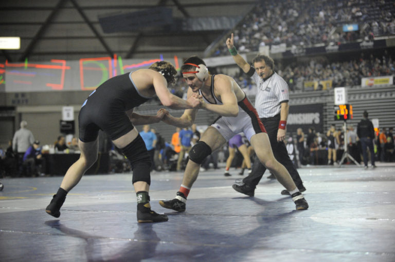 Gideon Malychewski from Camas wrestles in front of a packed Tacoma Dome.  Bad weather forced regional tournaments to cancel so state had 32 man brackets instead of the normal 16.  Doubling the number of wrestlers created extra big crowds.