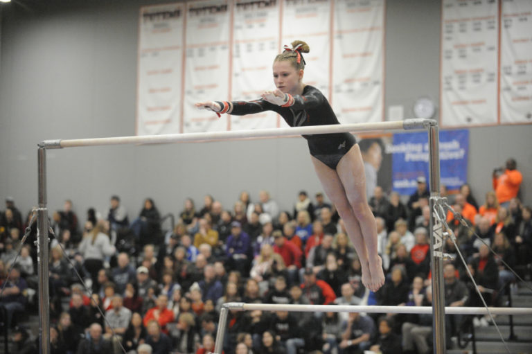Freshman Peyton Cody soars to the high bar at the state meet at Sammamish High School in Bellevue.