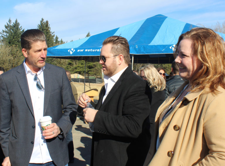 Camas Mayor Shannon Turk (right) talks to CWEDA President Paul Dennis (left) and Dawson's Ridge homeowner Albert Angelo.