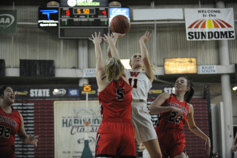 Junior McKinnley Stotts shoots a soft floater in the semi finals against Clarkston.