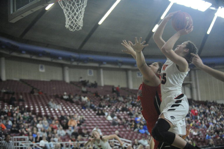 Skylar Bea attacks the basket and is fouled in the second half of the semi final game against Clarkston.