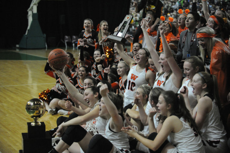 The Washougal Panthers hold up hard earned hardware and informally pose for the Washougal fans who made the trip to the 2A Hardwood Classic in Yakima, Wash., on Feb. 28.