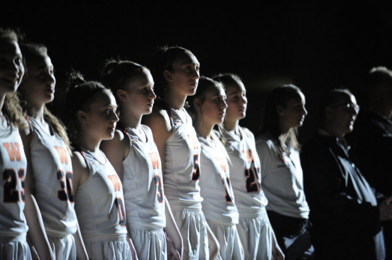 The team is announced under the spotlights for the state championship game in Yakima.