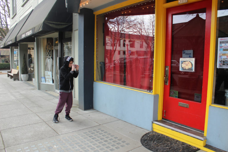 Washington State School for the Blind sixth-grader Jayme Gummerie, 12, takes a photo in downtown Camas on March 11.