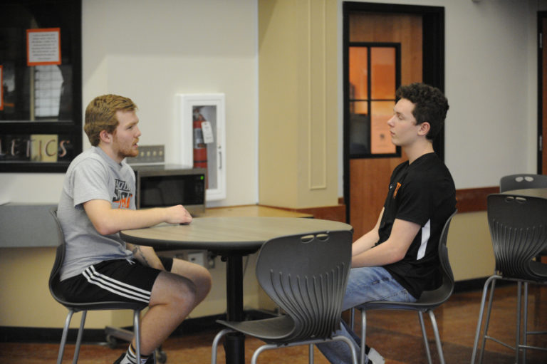 Senior Carter Murray and freshman Mason VanNostern talk soccer strategy during their lunch break at Washougal High School.
