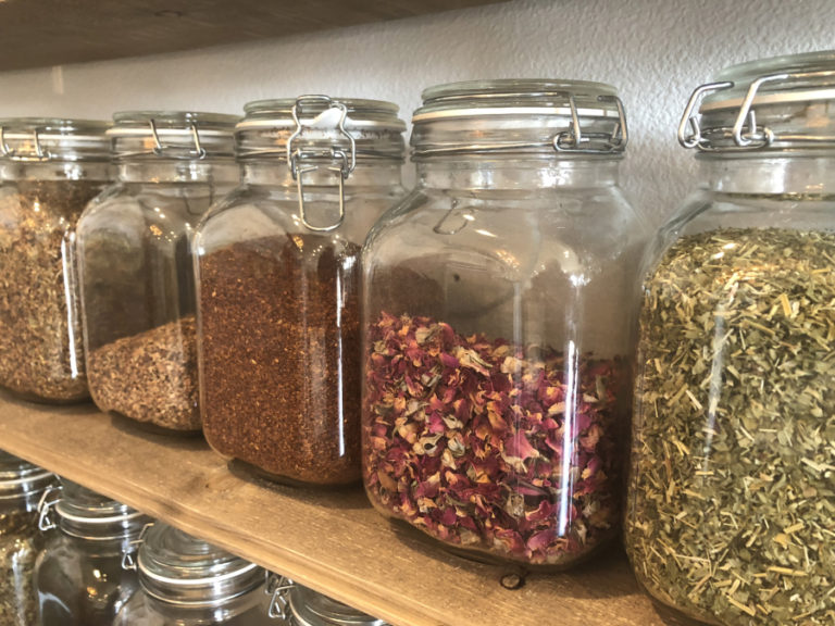 A wall of dried teas line the wall at Petal and Thorn Naturopathic Wellness Center and Apothecary in downtown Camas.