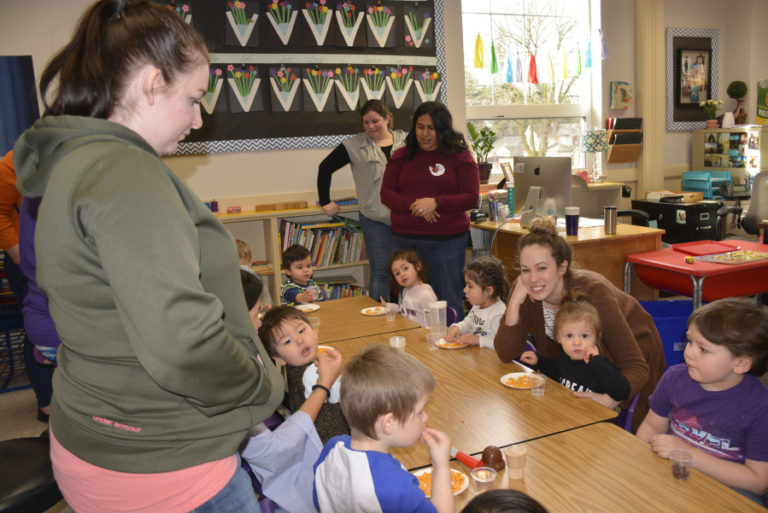 Young students enjoy snacks after reading and other activities during a recent 1,2,3 Grow and Learn session at Hathaway Elementary School.