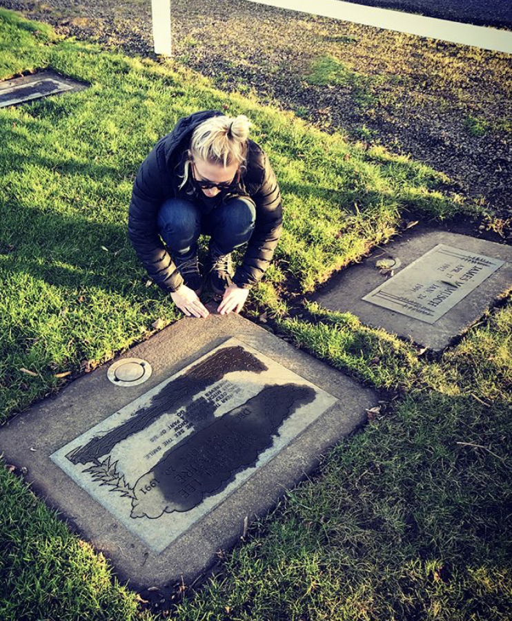 Emily Whitmire visits her father&#039;s grave in Washougal during a December 2018 trip to visit her family.