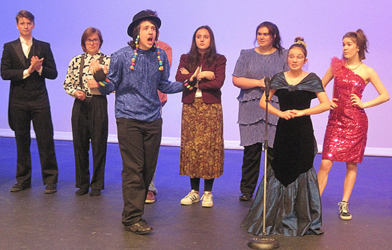 From left to right, Washougal High School students Mathias Hight, Savanna Slocum, Matt Condon, Sofia Gunn, Haley Barlow, Audrey Flock and Courtney Dillman rehearse a scene from &quot;The Awesome &#039;80s Prom&quot; at the school theater on April 11.