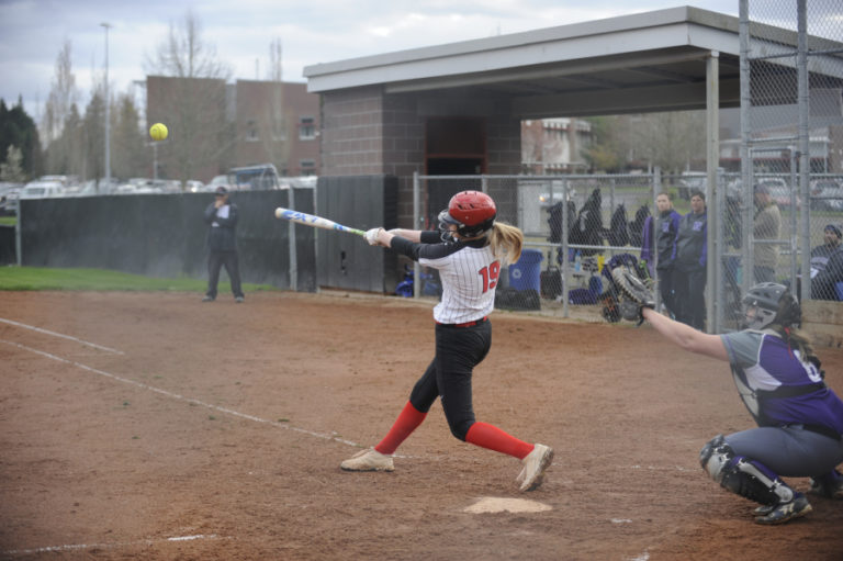 Camas junior Marley Foster launches the ball to center field, helping to ice the comeback in a 4-2 win over Heritage on April 9.