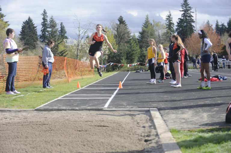 Washougal junior Gracie Dolan takes off for the triple jump competition.