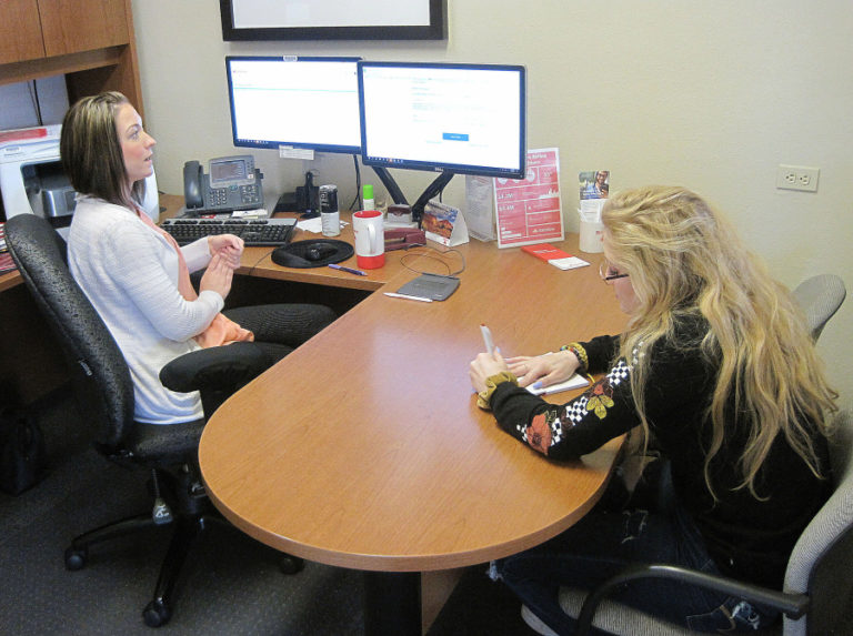 Tiffany Jones (left) introduces Hayes Freedom High School senior Maggie Mack to insurance concepts April 18 at Nathan Loren State Farm Insurance in Washougal. Mack began an internship at State Farm earlier this month.